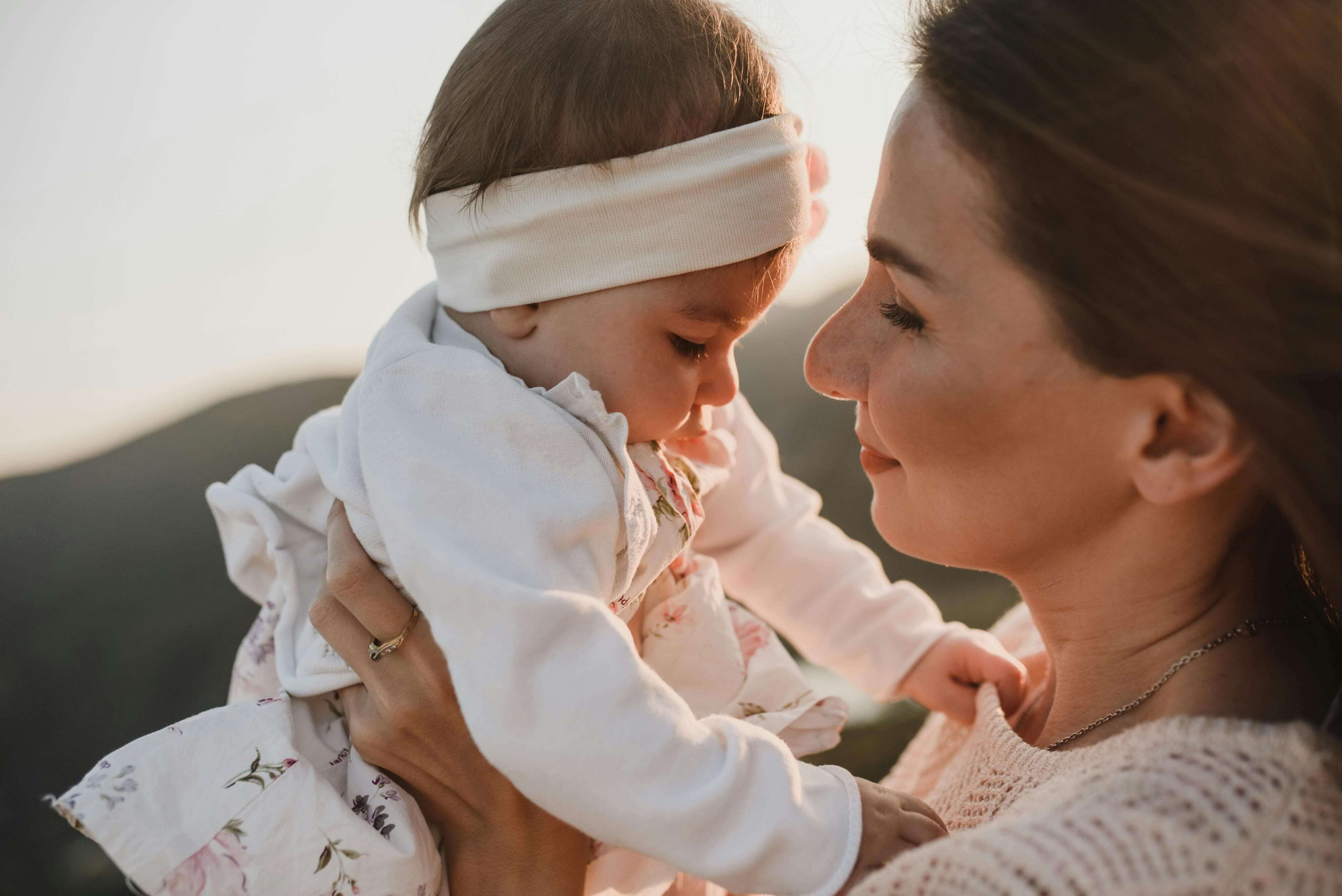 Mother holding a baby girl